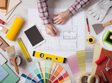 Professional decorator working at desk
